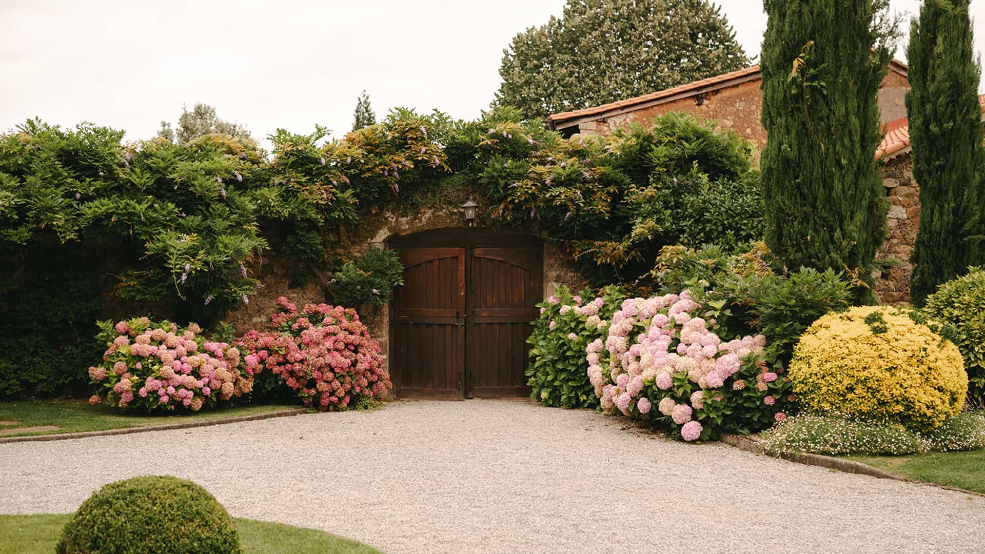 Bride reading a book next to the Victorian-style bathtub